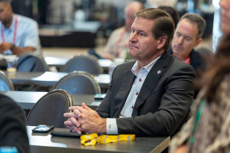 Oct 15, 2025; Birmingham, AL, USA; Texas A&M Aggies athletic director Trev Alberts watches as head coach Bucky McMillan talks with the media during SEC Media Days at Grand Bohemian Hotel. Mandatory Credit: Vasha Hunt-Imagn Images