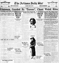 Klansmen, guarded by 'Terrors', chant weird rites