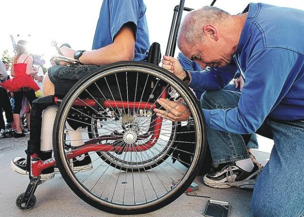 Dad-powered wheelchair aids teen in marching band  