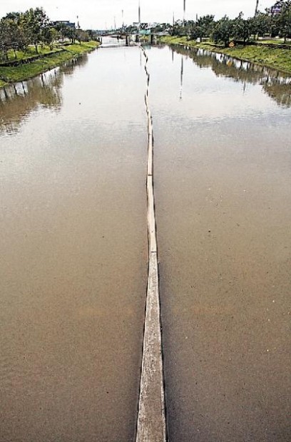 High-water rescues, outages and many dazed Ike evacuees  