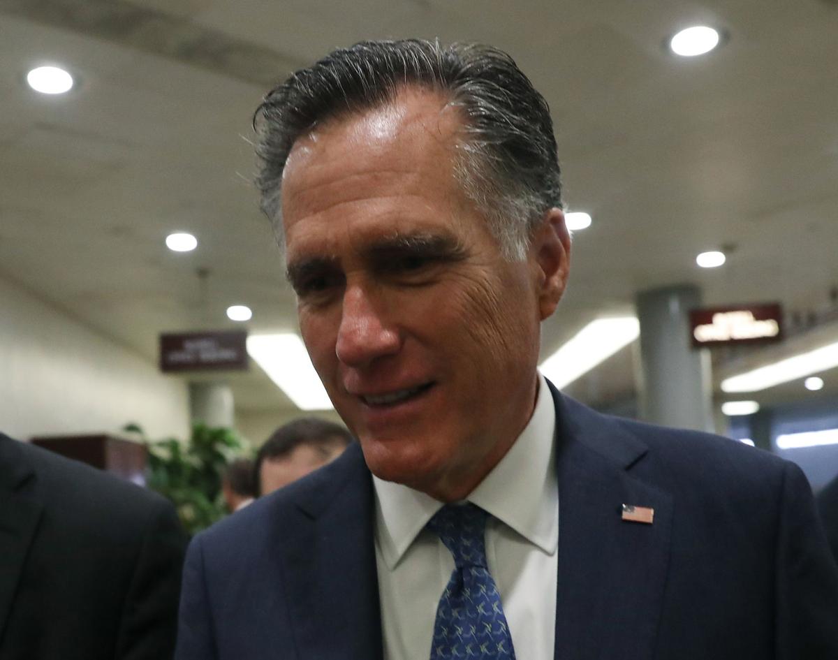 Sen. Mitt Romney (R-Utah) walks past reporters on his way to a vote before attending the weekly Republican policy luncheon on Capitol Hill on September 24, 2019, in Washington, D.C.