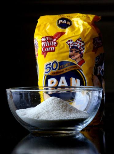 Making arepas, Colombian and Venezuelan bread