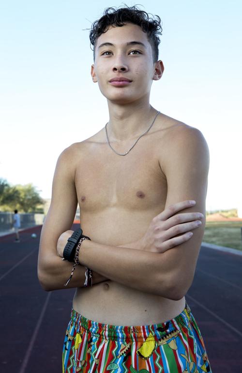 Skinny boy age 15 standing with back against a brick wall. high definition  on Craiyon