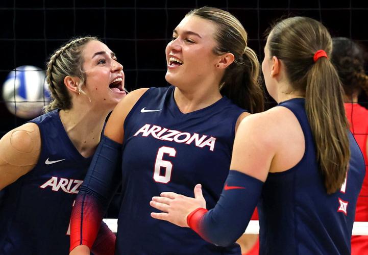 Red and Blue volleyball match at McKale Center