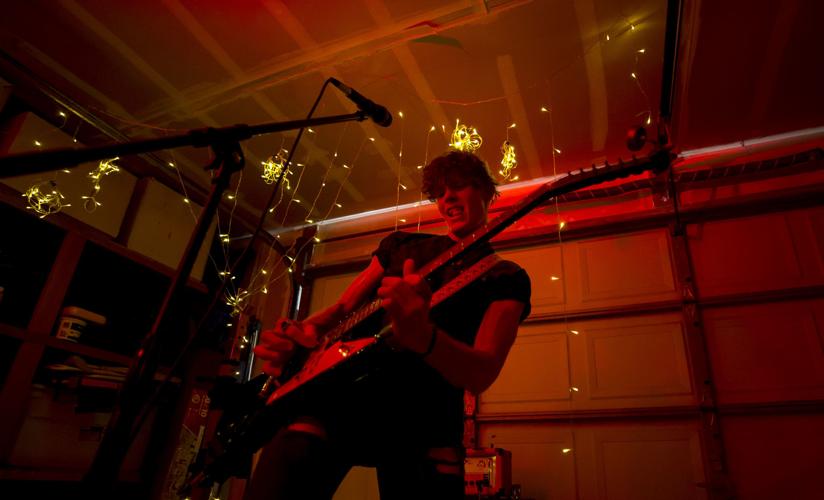 Noah Martin plays guitar