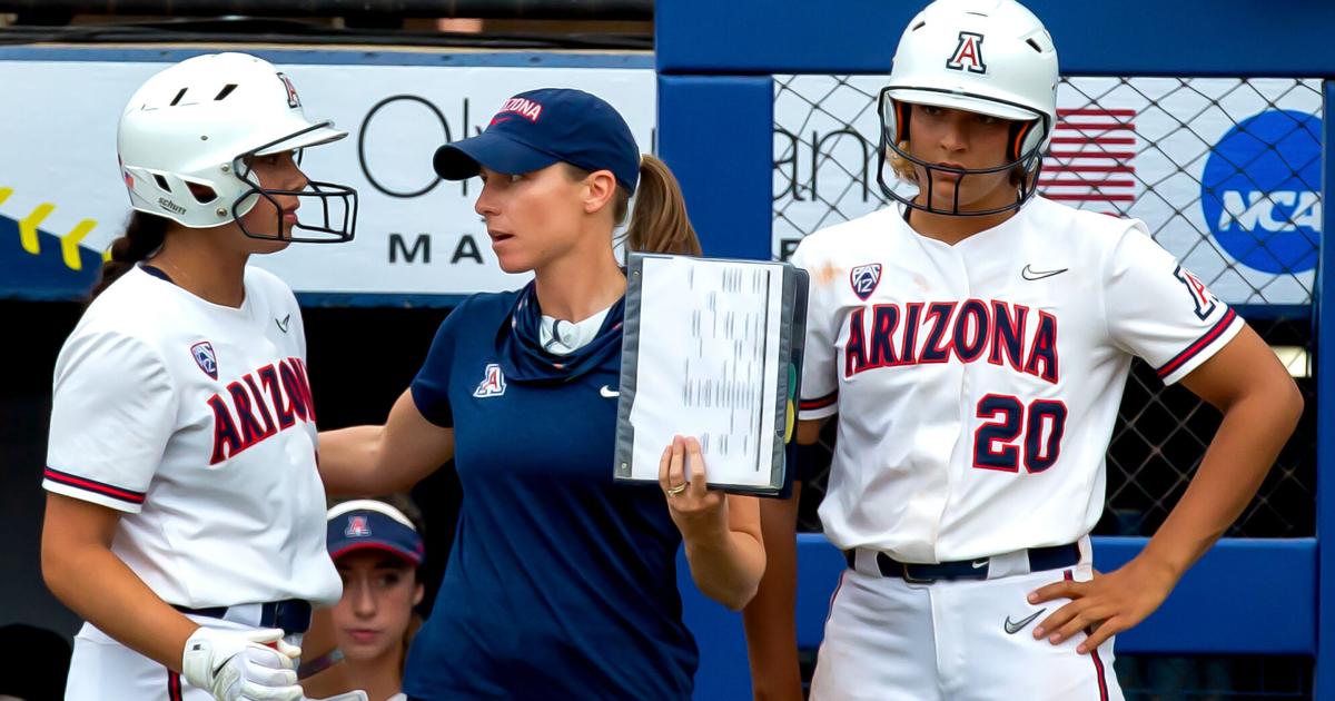 D-backs third base coach watching his daughter at the WCWS