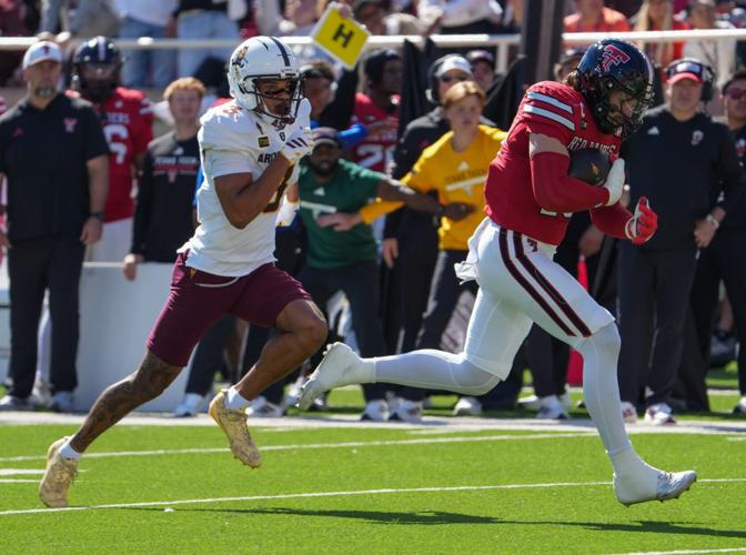 Texas Tech's Ben Roberts returns an interception for a touchdown against Arizona State during a Big 12 Conference football game,