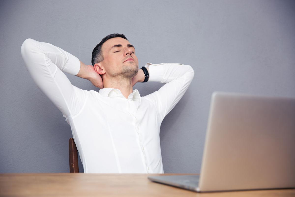 Handsome businessman sleeping at the table