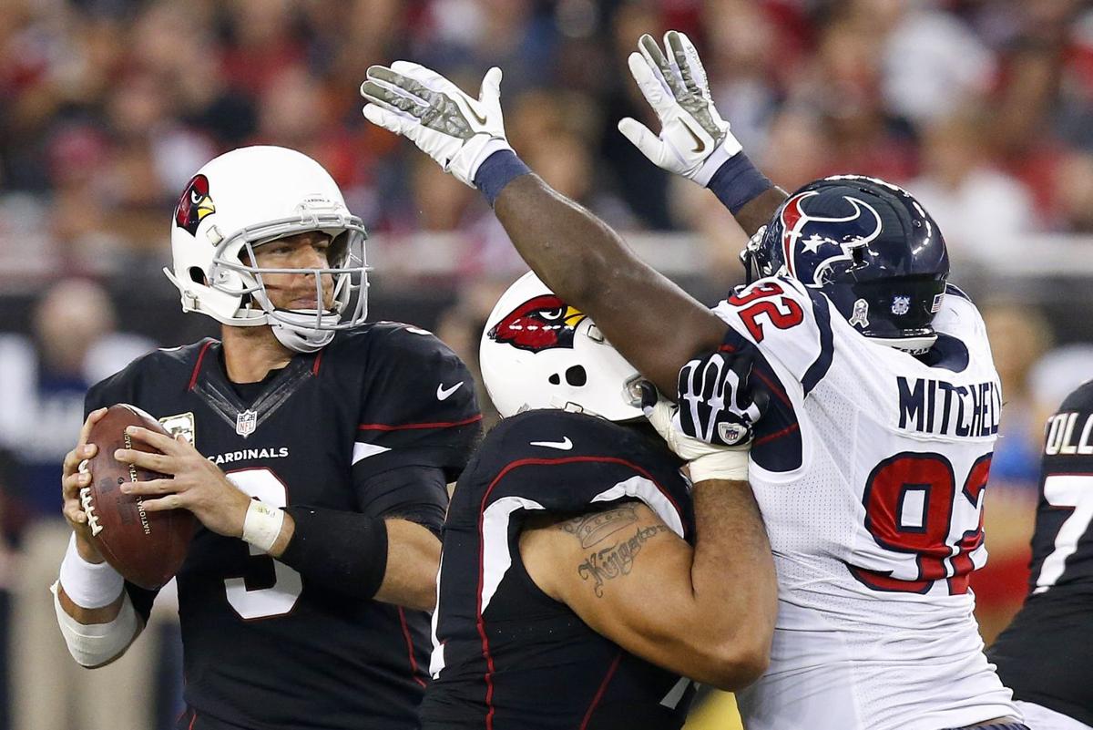 Carson Palmer, Paul Fanaika, Earl Mitchell