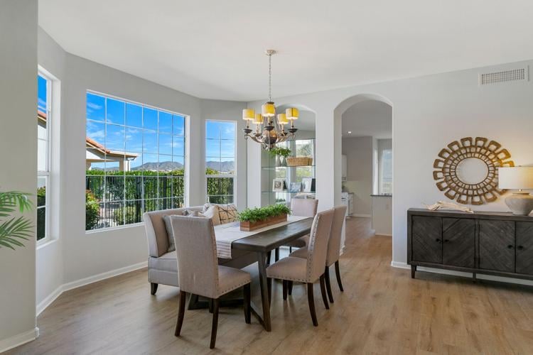Staging-the-dining-room-table-in-a-unnconventional-position-improves-flow-and-showcases-the-bay-window-setting.jpg