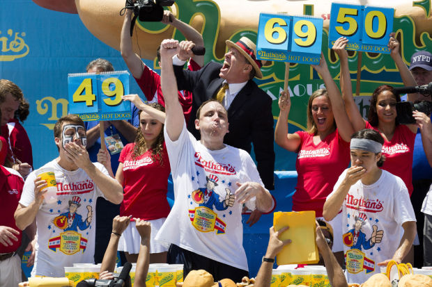 Joey Chestnut downs 69 dogs for new record    