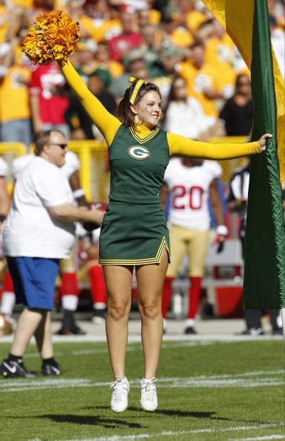 A Green Bay Packers cheerleader is seen before an NFL football