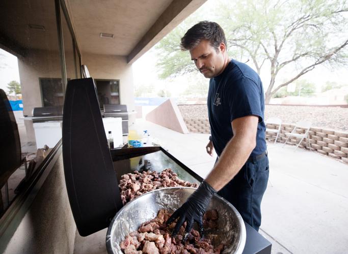TFD paramedic Scott cooks outside of Station 7