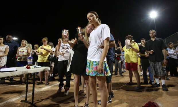 Vigil honors slain store clerk