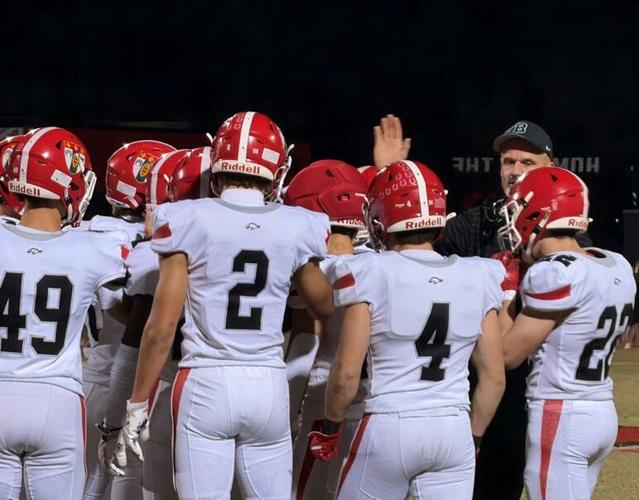Brophy coach Jason Jewell talks to his team prior to the start of the Broncos game at Liberty on Friday, Oct. 24, 2025.