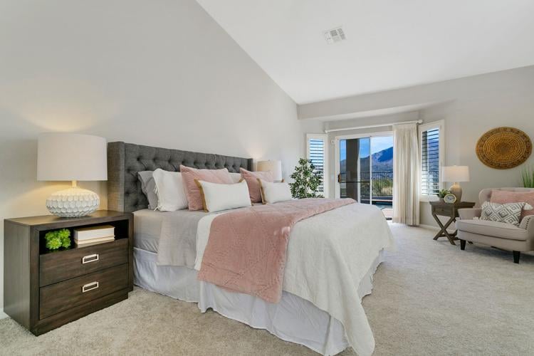 Kmet-s-positioning-of-the-lushly-staged-bed-takes-advantage-of-bedside-views-and-opens-space-for-two-seating-areas.jpg