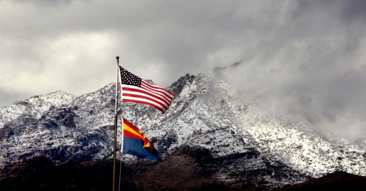 Snow, flags over Santa Catalinas