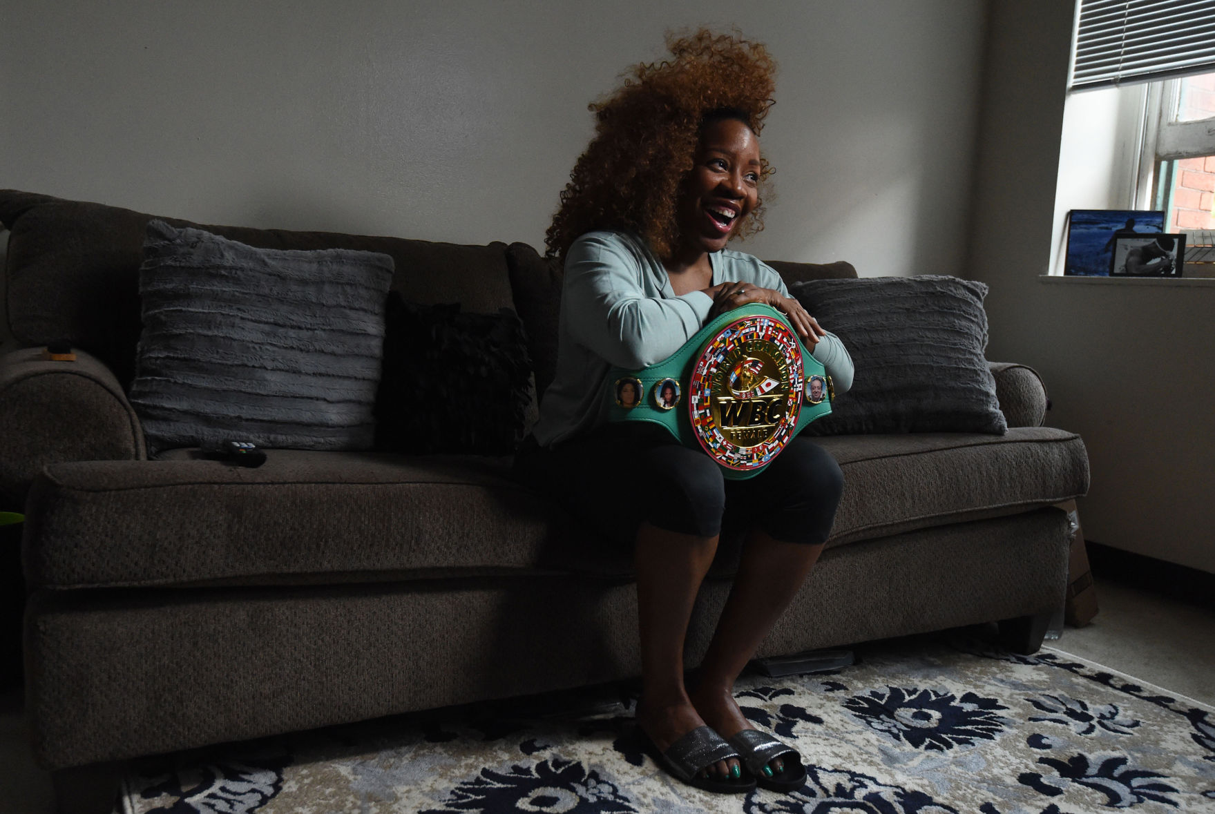 Franchon Crews-Dezurn, World Boxing Council Super Middleweight Champion, with her belt.