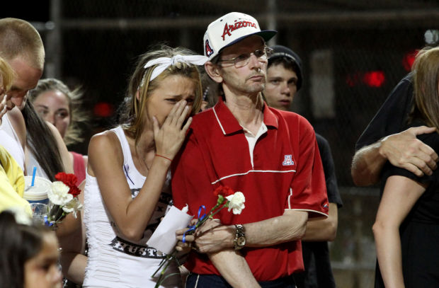 Vigil honors slain store clerk