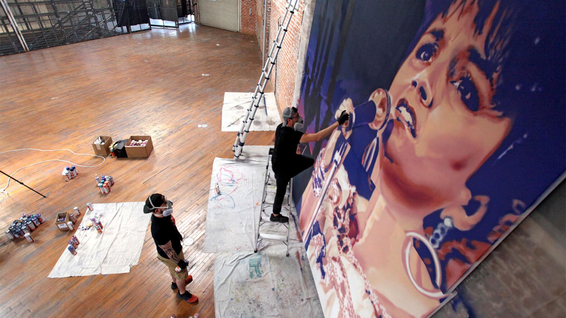 Photos: Rock Martinez paints mural of Linda Ronstadt