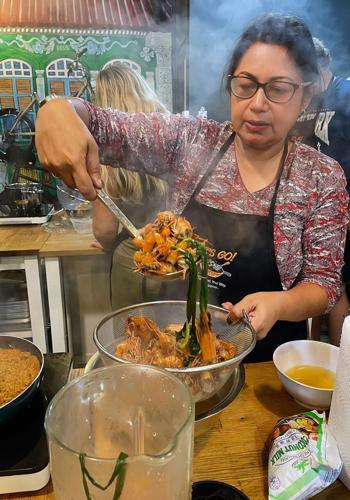 Vidhya Nair is our guide and here is giving a cooking class in Singapore.