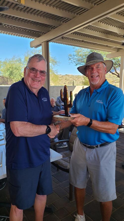 Scott-Baker-giving-the-Saguaro-Cup-back-to-Karl-Piepho-after-getting-to-hold-it-for-the-morning.jpg