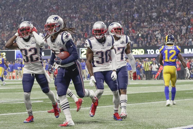 Los Angeles Rams receiver Brandin Cooks (12) walks away as New England Patriots defensive backs celebrate an interception by Stephon Gilmore (24) in the fourth quarter during Super Bowl LIII at Mercedes-Benz Stadium in Atlanta on Sunday, Feb. 3, 2019. The Patriots won, 13-3. (Robert Gauthier/Los Angeles Times/TNS