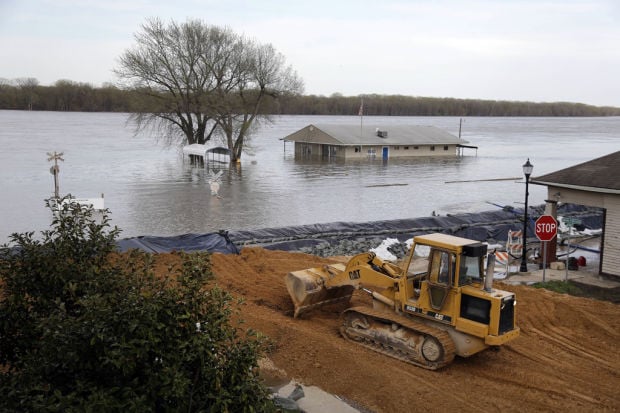 In Missouri tourist town, it's river views versus flood peril    