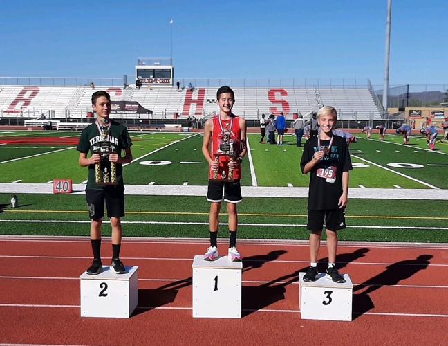 Eric Reed (left), Greyson Han (middle) and Gage Mahn (right) at the 2022 Deer Valley Unified District Cross Country Championships in eighth grade.