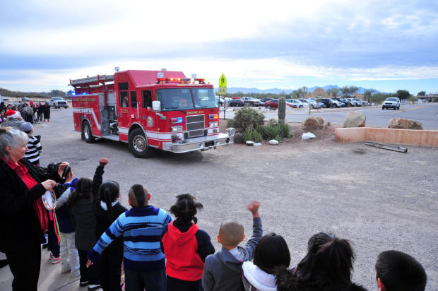 D-M’s Santas-in-blue visit local school