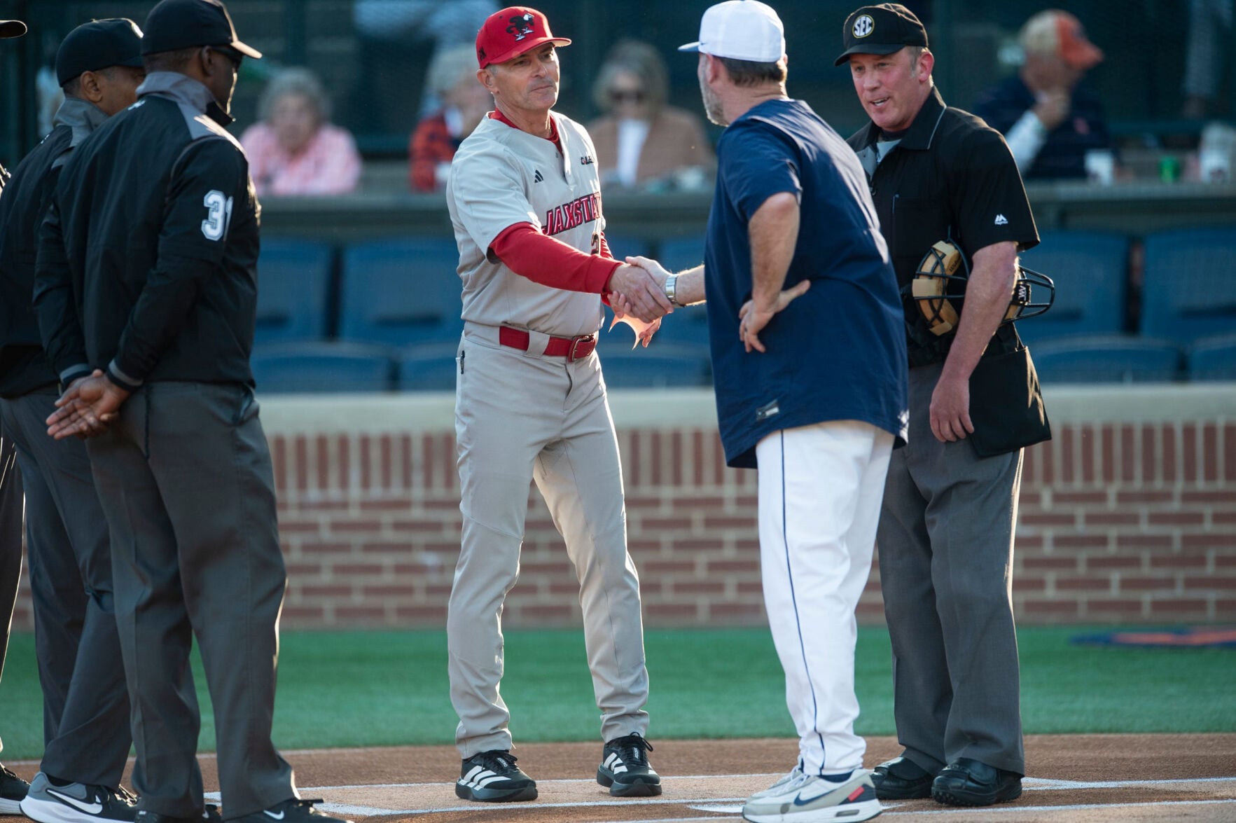 Jacksonville State Gamecocks head coach Steve Bieser and Auburn Tigers head coach Butch Thompson shake hands before the game as Auburn Tigers take on Jacksonville State Gamecocks at Plainsman Park in Auburn, Ala. on Tuesday, April 7, 2026.