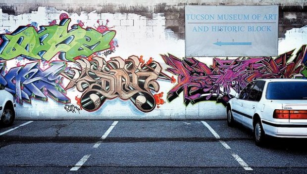 Downtown wall that stirred furor redone with less-strident imagery  