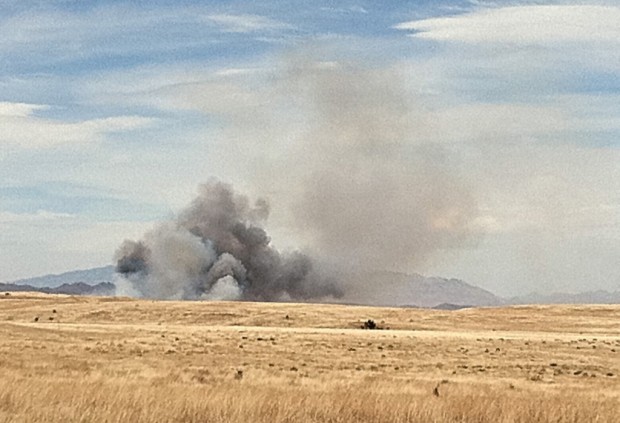 Grass fire burning near Empire Ranch