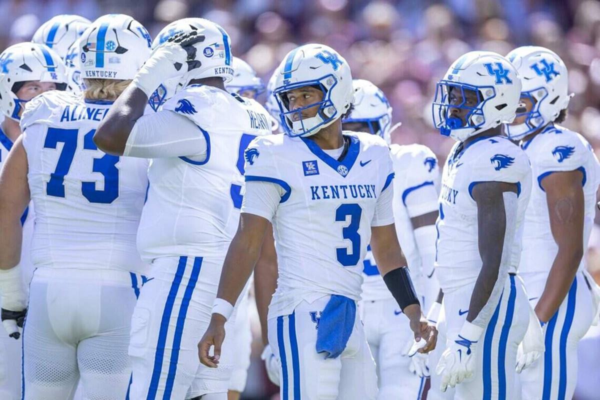 Kentucky Wildcats quarterback Kenny Minchey stands in a huddle with his teammates during a game against the Texas A&M Aggies at Kyle Field in College Station, Texas, on Saturday, Sept. 19, 2026.