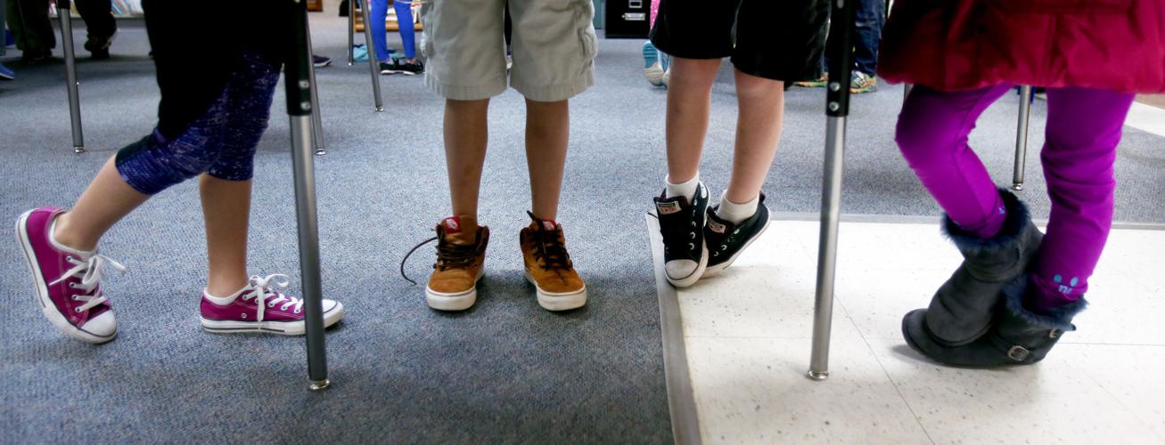 Kids use standing desks