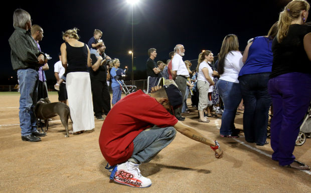 Vigil honors slain store clerk