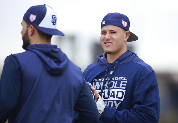San Diego Padres infielders Manny Machado, right, and Eric Hosmer talk during a spring training practice on Friday, Feb. 22, 2019, in Peoria, Ariz. Machado agreed to a 10-year, $300 million contract with the Padres.