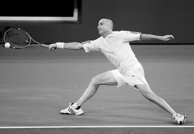Agassi outlasts Baghdatis to stay alive  
