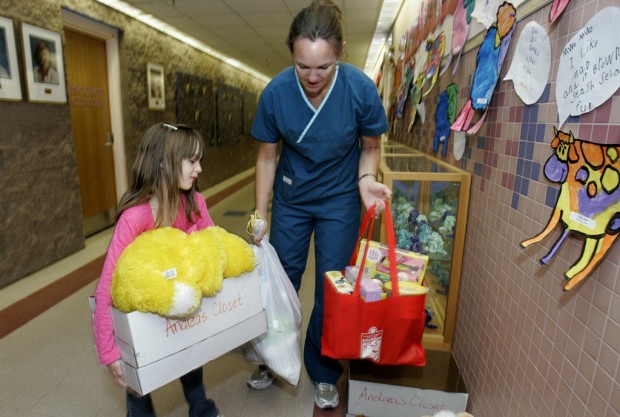 First-grader, fuzzy friend collect toys for TMC effort    