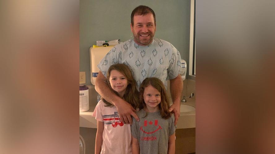 Ryan Newman with his two daughters