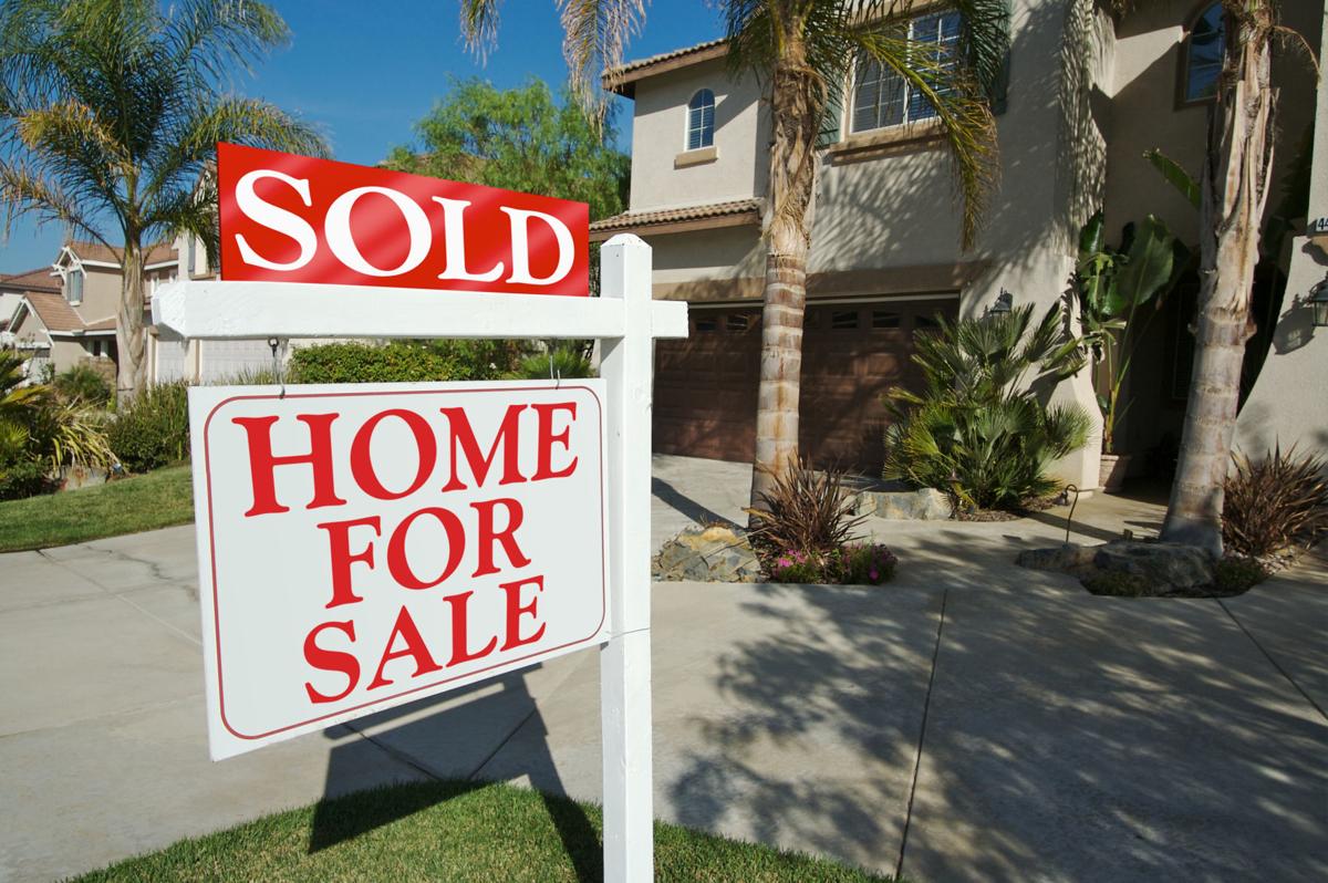 Sold Home For Sale Sign and New House