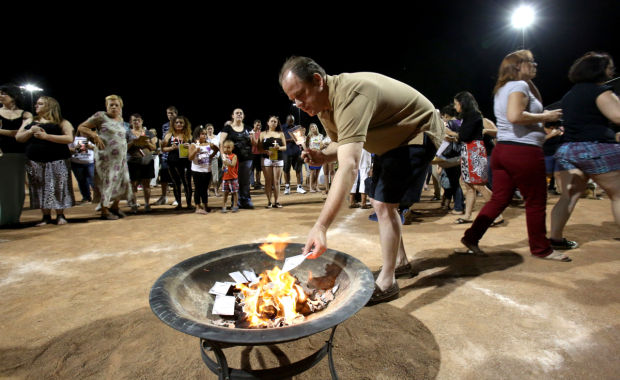 Vigil honors slain store clerk
