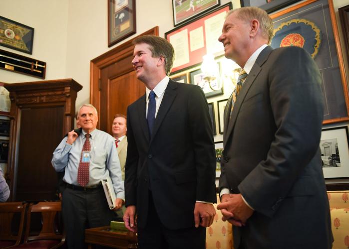 Supreme Court nominee Brett Kavanaugh and Sen. Lindsey Graham (R-SC), right, pose for the media in Graham's Russell Senate