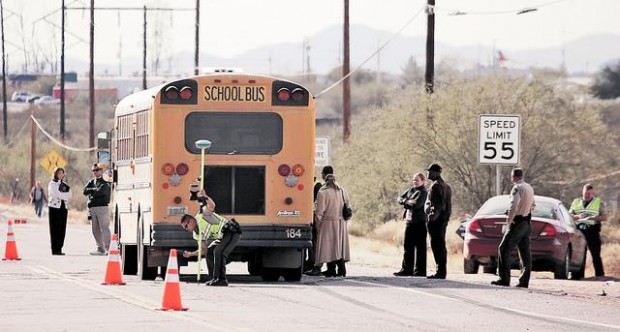 Car hits school bus, kids while boarding; 5 hurt  