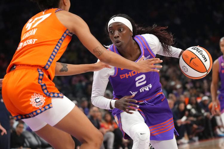 Phoenix Mercury guard Kahleah Copper (2) looks to drive past Connecticut Sun guard Leila Lacan (47) at Mortgage Matchup Center in Phoenix on July 19, 2026.