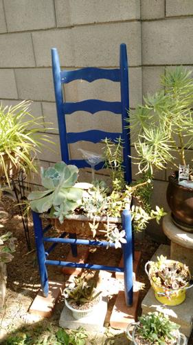 Recycled chair as planter