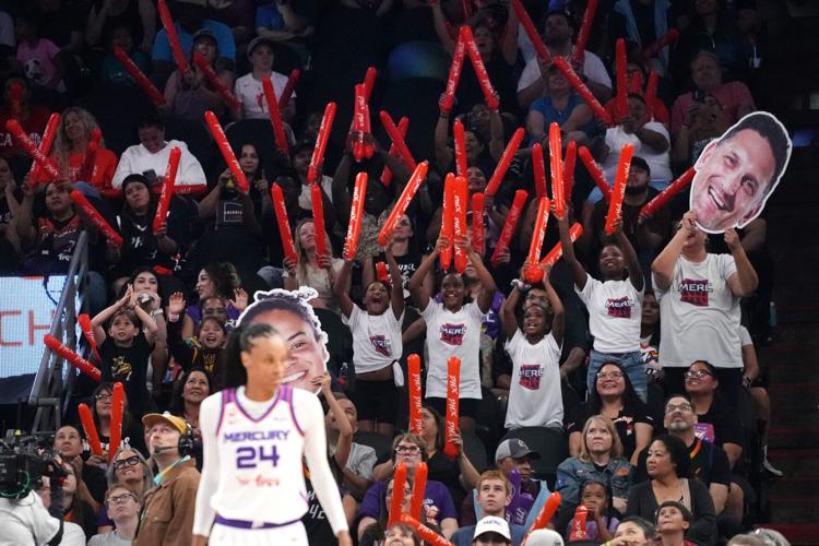 Fans cheer from the stands as the Phoenix Mercury