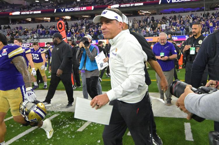 Dec 13, 2025; Inglewood, CA, USA; Washington Huskies head coach Jedd Fisch runs on to the field after defeating the Boise State Broncos in the LA Bowl at SoFi Stadium. Mandatory Credit: Jayne Kamin-Oncea-Imagn Images
