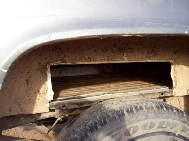 Dope smuggler's pickup gets stuck on homemade ramp over border fence  