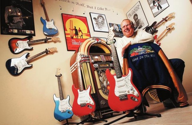 Music fan keeps signatures of rock stars on everything from posters to prized guitars  